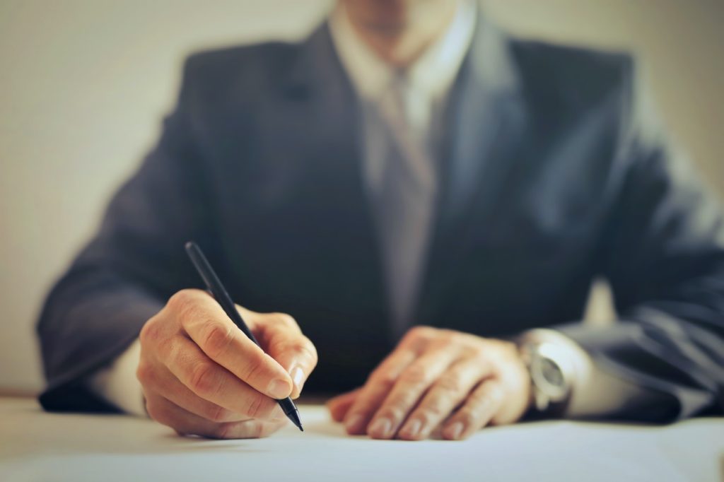 person writing documents