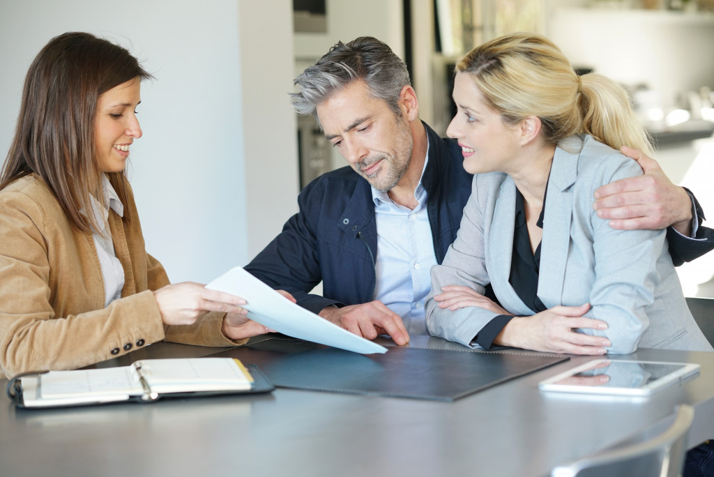a couple meeting with an attorney to plan their estate